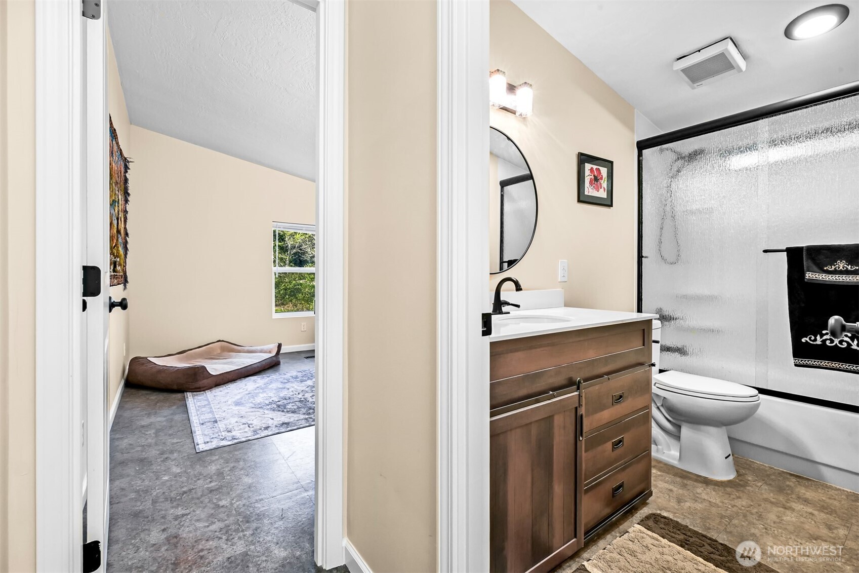 4930 Noon Road Bellingham, WA 98226 - Photo 13 of 27 a bathroom with a granite countertop sink a toilet and a mirror