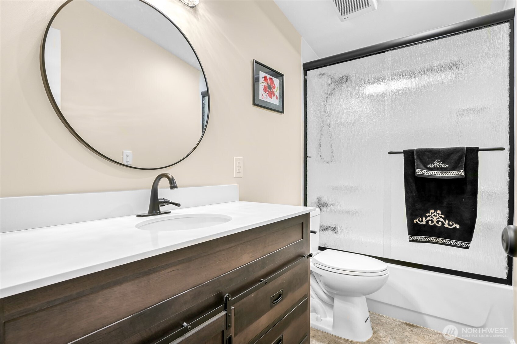 4930 Noon Road Bellingham, WA 98226 - Photo 14 of 27 a bathroom with a sink a toilet and a mirror