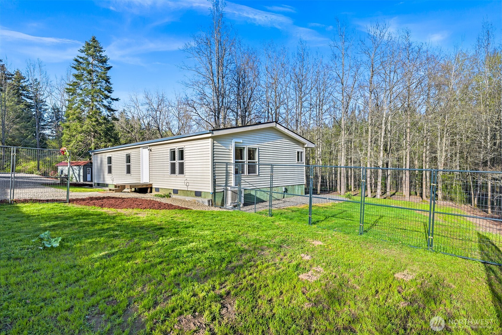 4930 Noon Road Bellingham, WA 98226 - Photo 24 of 27 a view of a house with backyard and trees