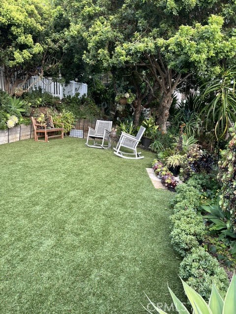 263 Upland Road Laguna Beach, CA 92651 - Photo 39 of 56 a view of a chair and table in the garden