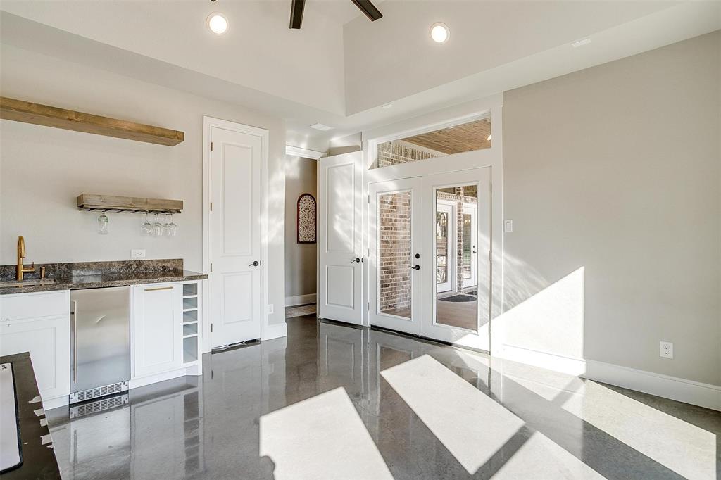 3207 Hummingbird Court Granbury, TX 76049 - Photo 14 of 40 a living room with furniture and a table