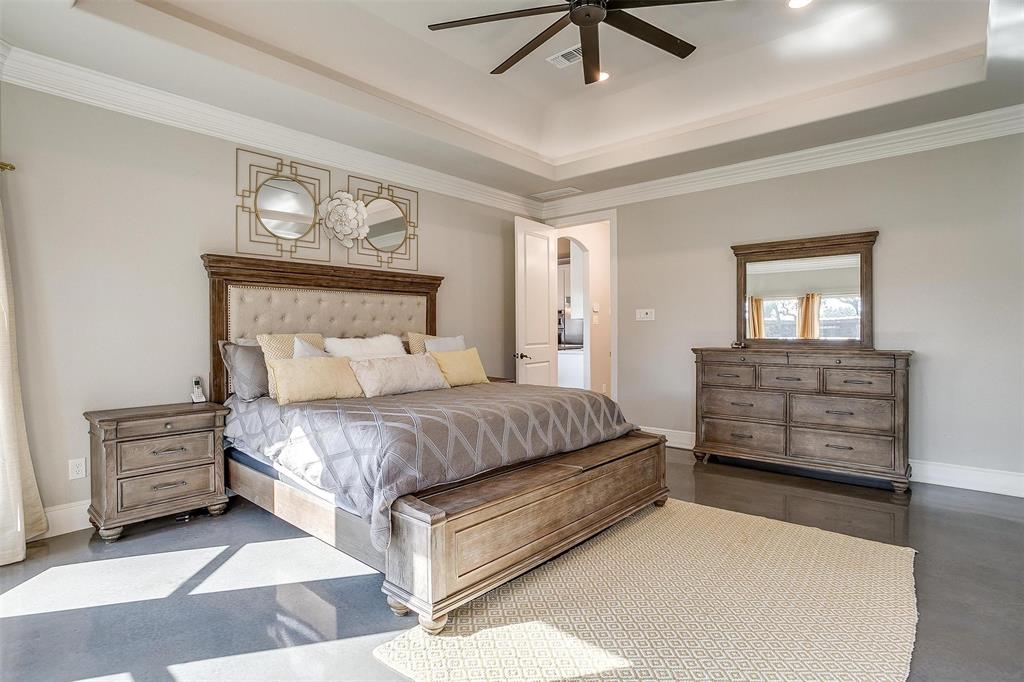 3207 Hummingbird Court Granbury, TX 76049 - Photo 17 of 40 a bedroom with a bed and ceiling fan