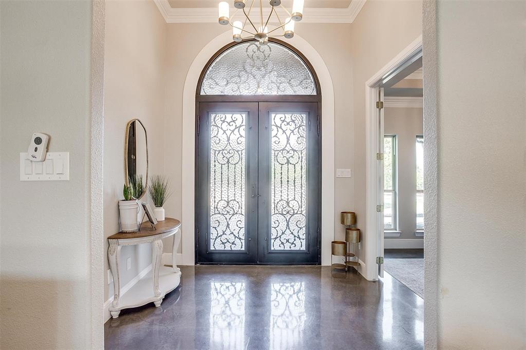 3207 Hummingbird Court Granbury, TX 76049 - Photo 2 of 40 a view of an entryway with wooden floor and door