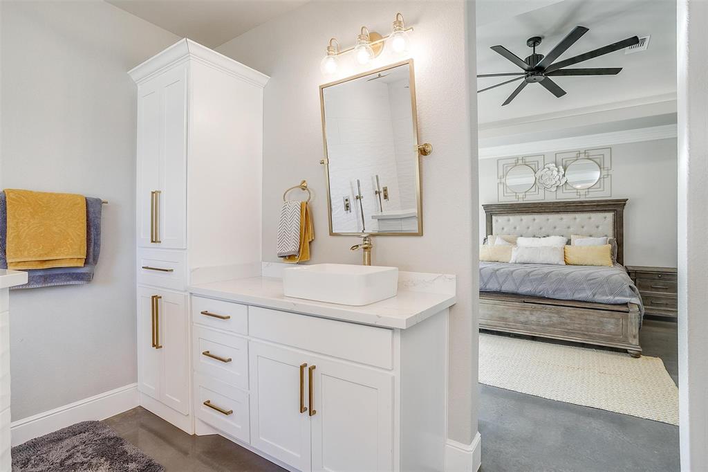 3207 Hummingbird Court Granbury, TX 76049 - Photo 21 of 40 a bathroom with a sink and a mirror