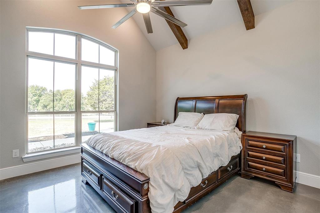 3207 Hummingbird Court Granbury, TX 76049 - Photo 25 of 40 a bedroom with a bed and a large window