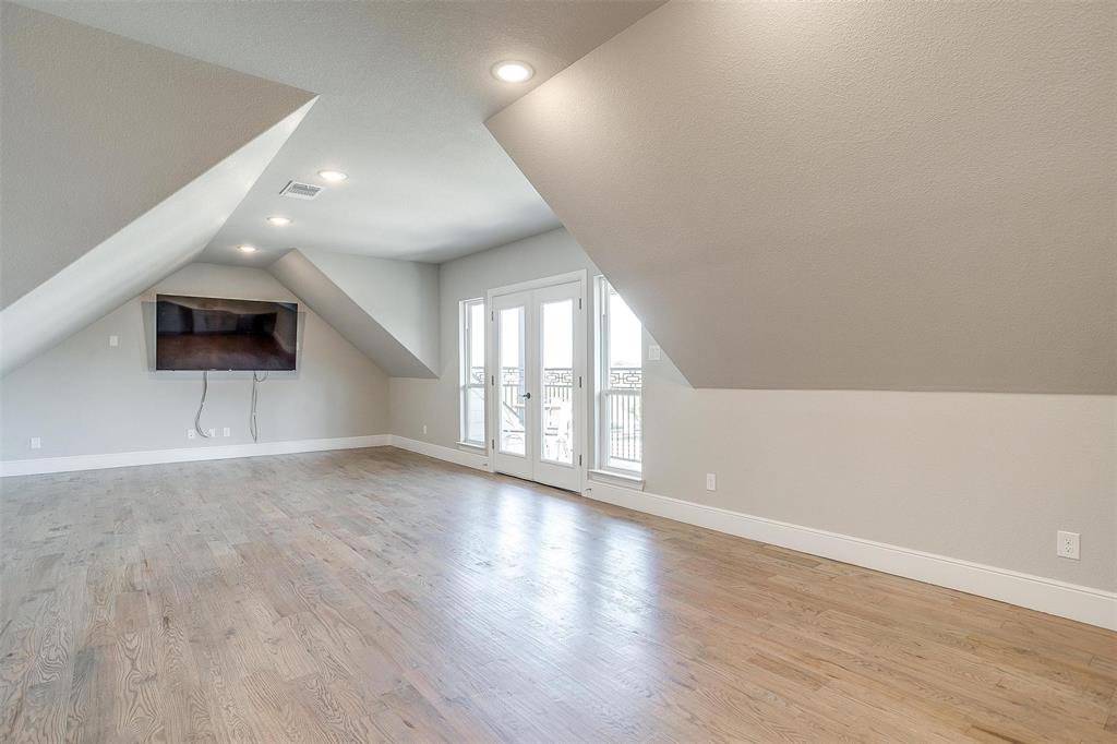 3207 Hummingbird Court Granbury, TX 76049 - Photo 28 of 40 an empty room with wooden floor and windows
