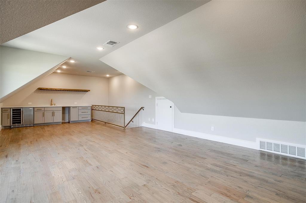 3207 Hummingbird Court Granbury, TX 76049 - Photo 29 of 40 an empty room with wooden floor and windows