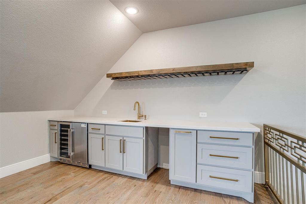 3207 Hummingbird Court Granbury, TX 76049 - Photo 30 of 40 a view of cabinets and wooden floor
