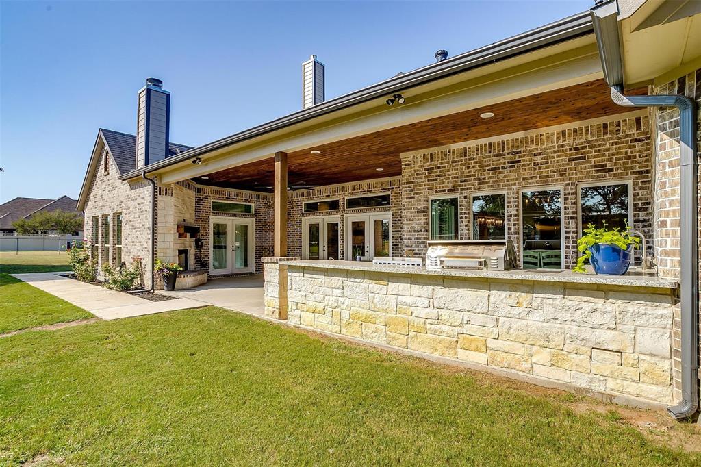 3207 Hummingbird Court Granbury, TX 76049 - Photo 33 of 40 a view of a house with a swimming pool