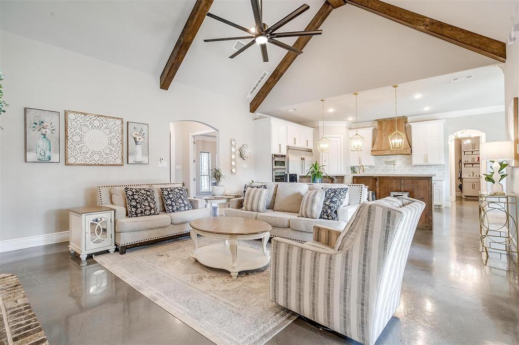 3207 Hummingbird Court Granbury, TX 76049 - Photo 4 of 40 a living room with furniture and a wooden floor