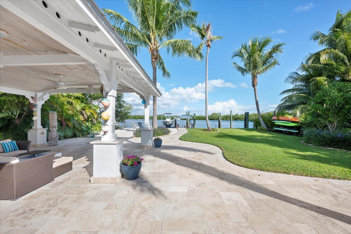 119 Elsa Road Jupiter, FL 33477 - Photo 12 of 44 a view of a swimming pool with a patio