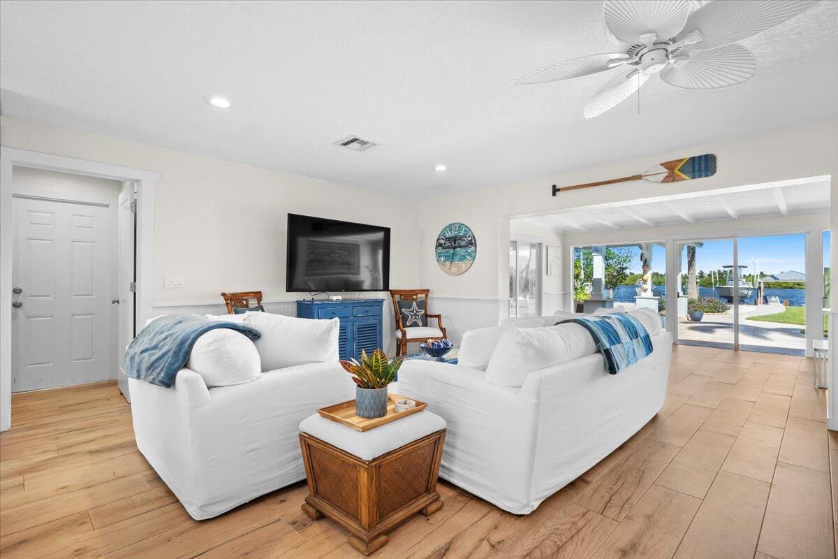 119 Elsa Road Jupiter, FL 33477 - Photo 18 of 44 a living room with furniture and a large window