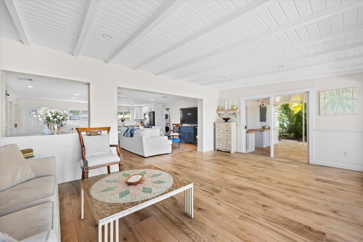 119 Elsa Road Jupiter, FL 33477 - Photo 24 of 44 a living room with furniture and wooden floor