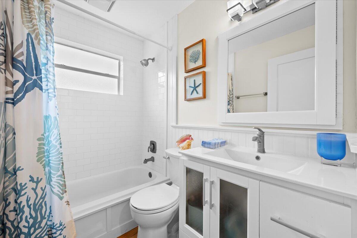 119 Elsa Road Jupiter, FL 33477 - Photo 31 of 44 a bathroom with a sink toilet and shower