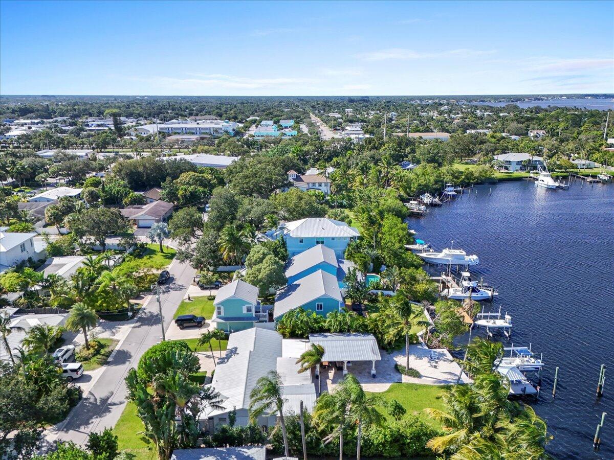 119 Elsa Road Jupiter, FL 33477 - Photo 36 of 44 an aerial view of a house with a lake view