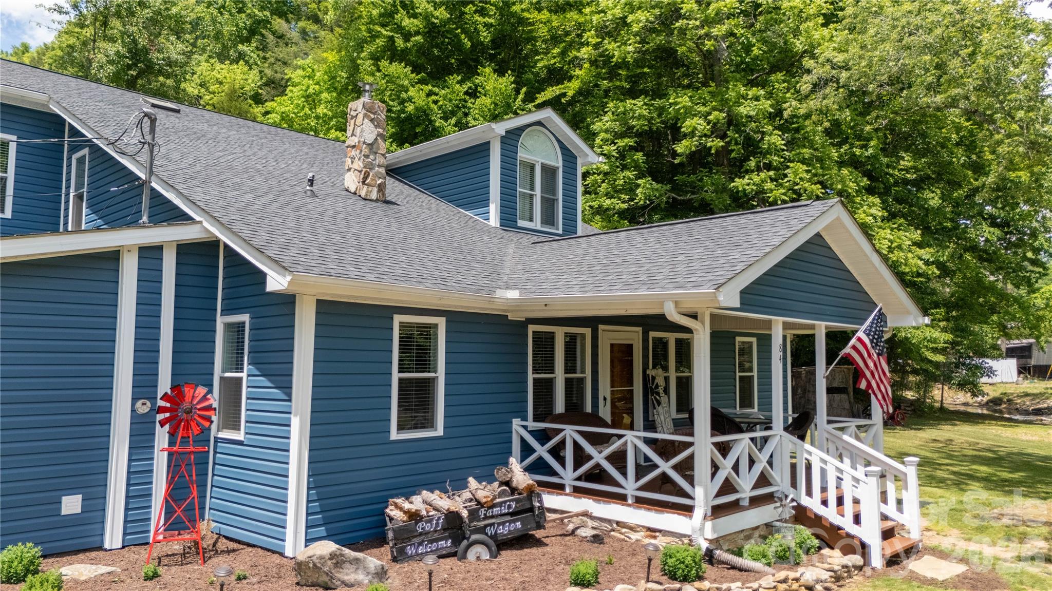 84 Sheets Farm Road Bakersville, NC 28705 - Photo 6 of 42 a house view with a garden space