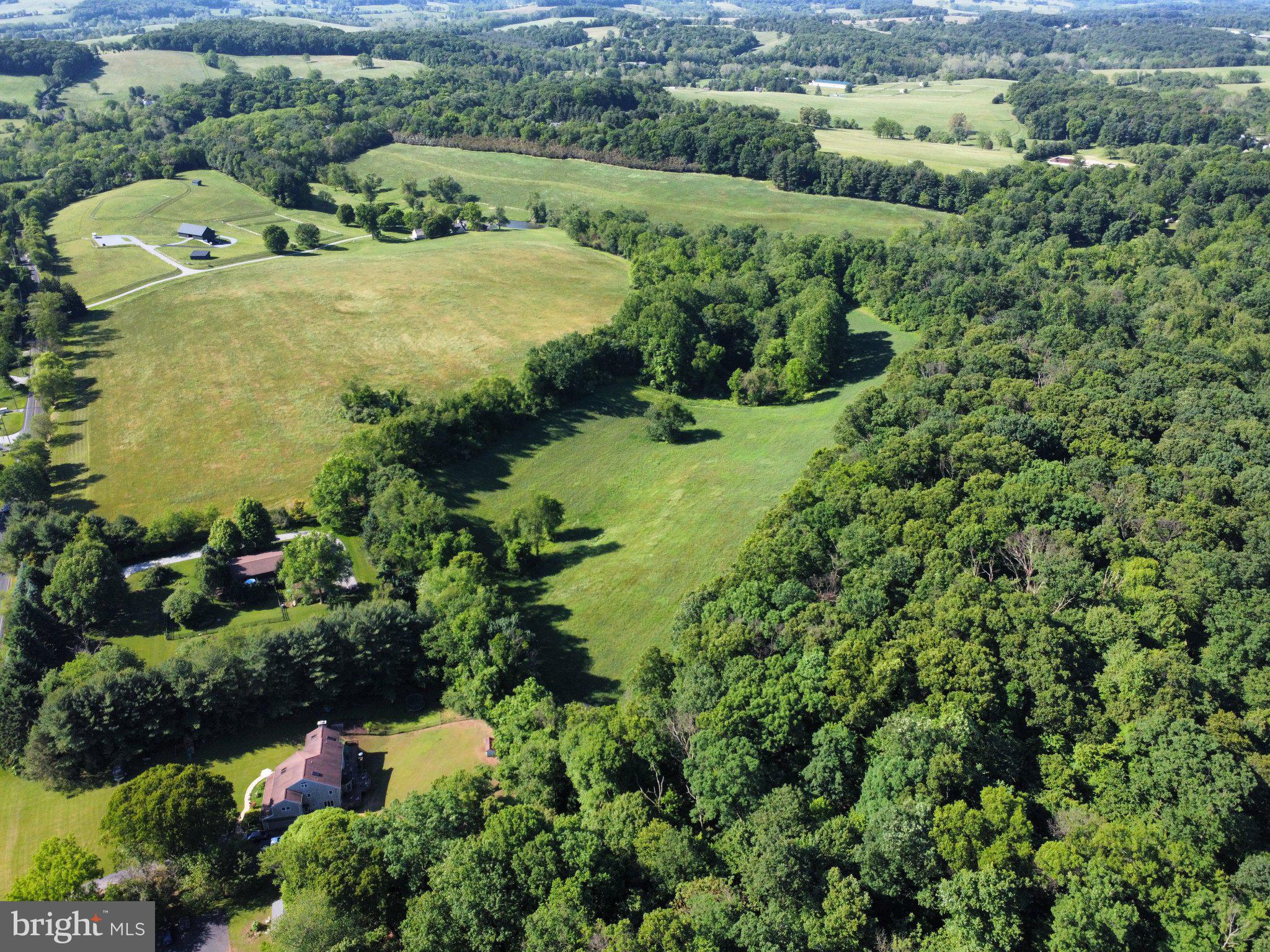 970 Doe Run Road East Fallowfield, PA 19320 - Photo 1 of 16 an aerial view of a house with a yard