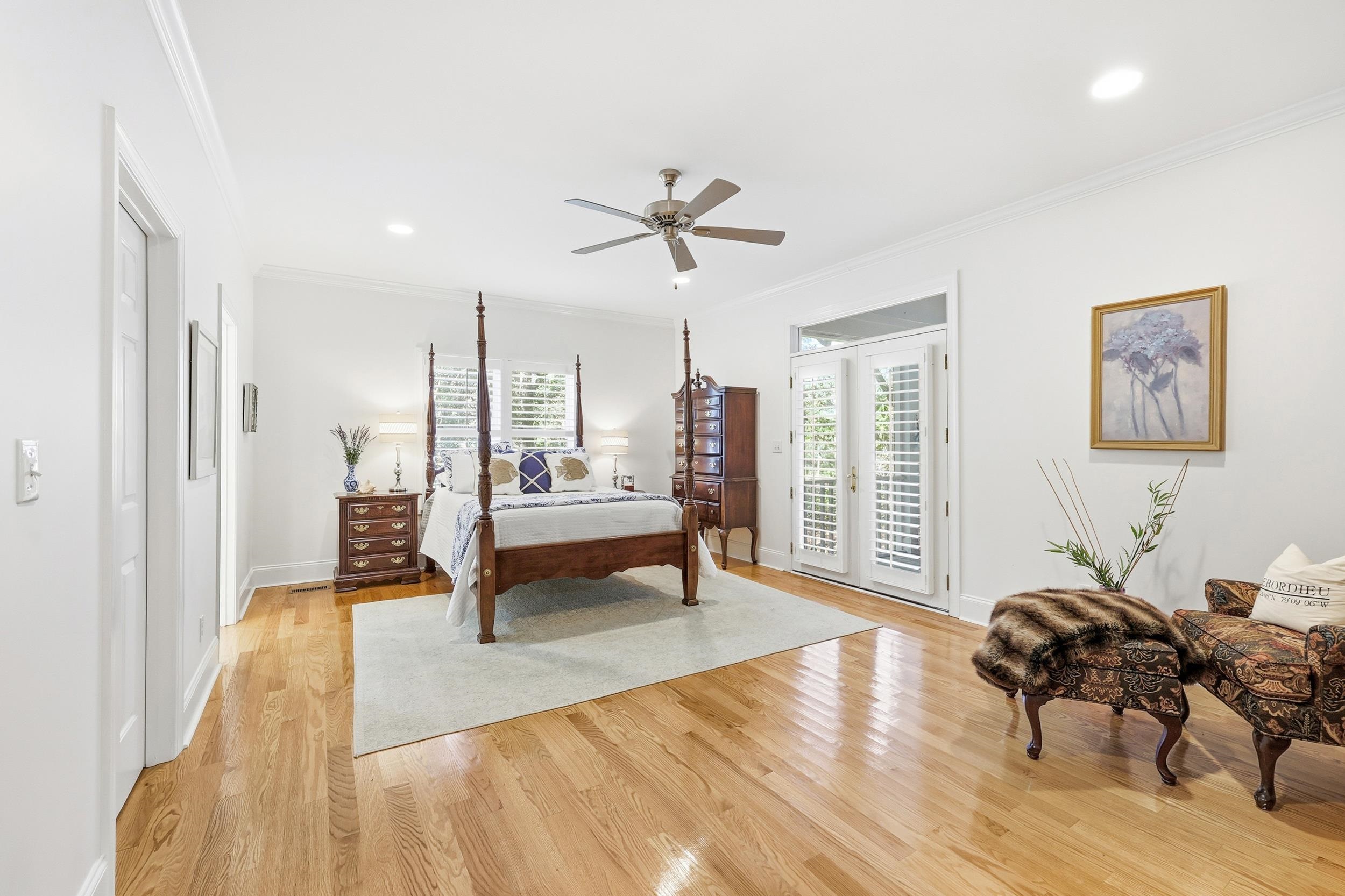 213 Old Carriage Loop Georgetown, SC 29440 - Photo 23 of 40 Bedroom with light wood-type flooring, access to outside, crown molding, french doors, and ceiling fan