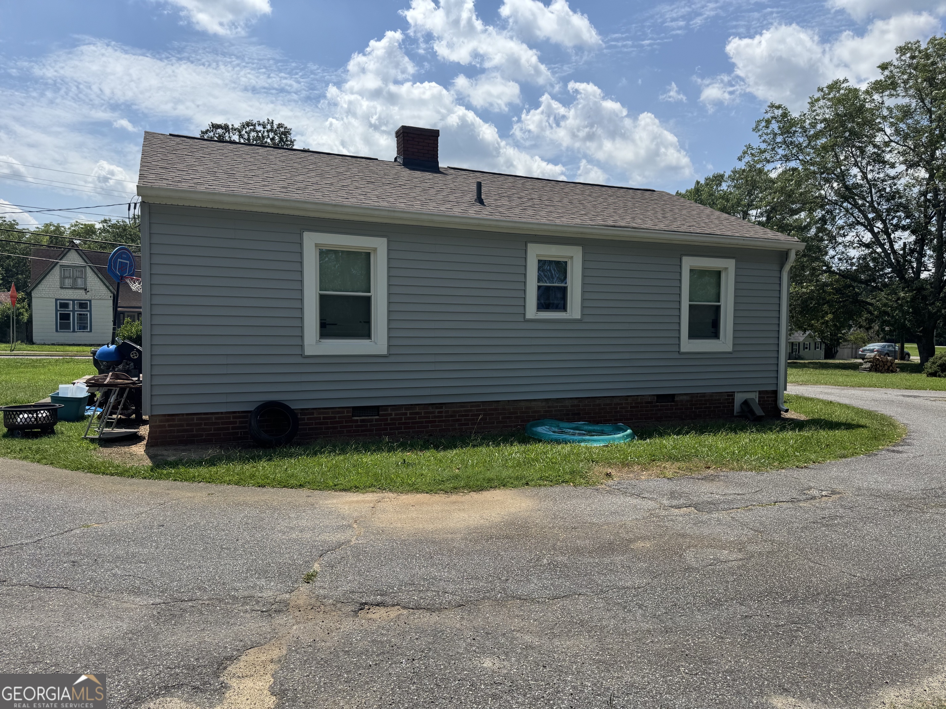 875 Benson Street Hartwell, GA 30643 - Photo 2 of 2 a view of backyard of house and trees