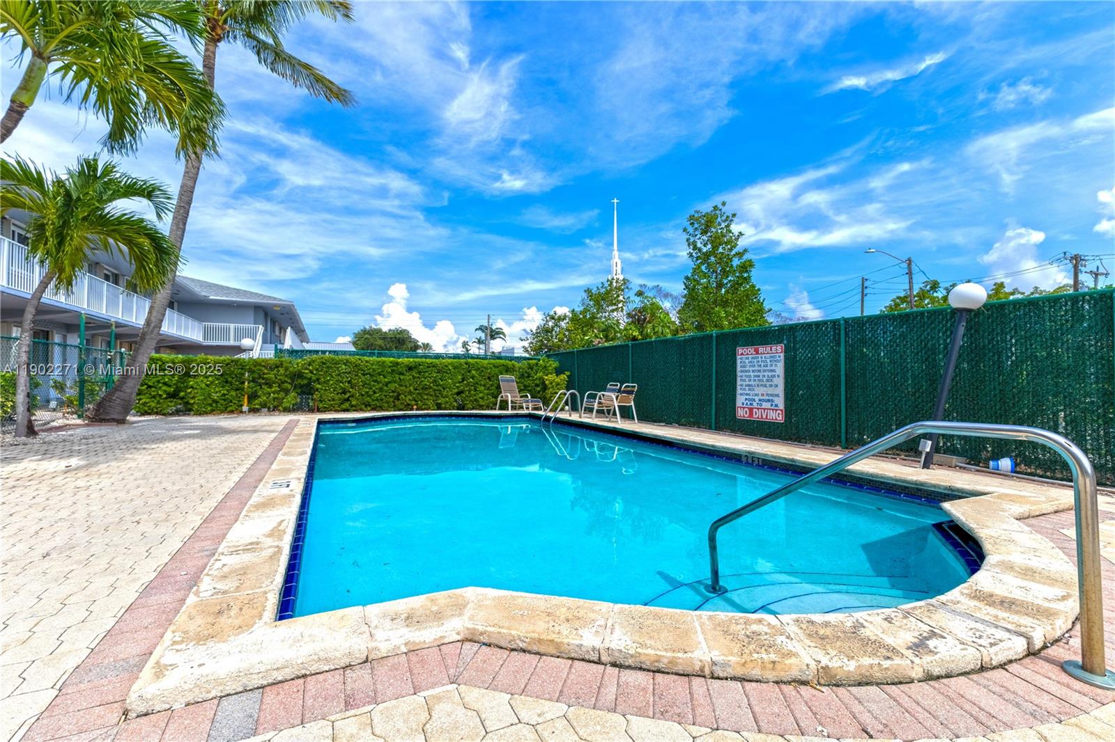 2175 Northeast 56th Street, Unit 105 Fort Lauderdale, FL 33308 - Photo 23 of 26 a view of a swimming pool with a yard
