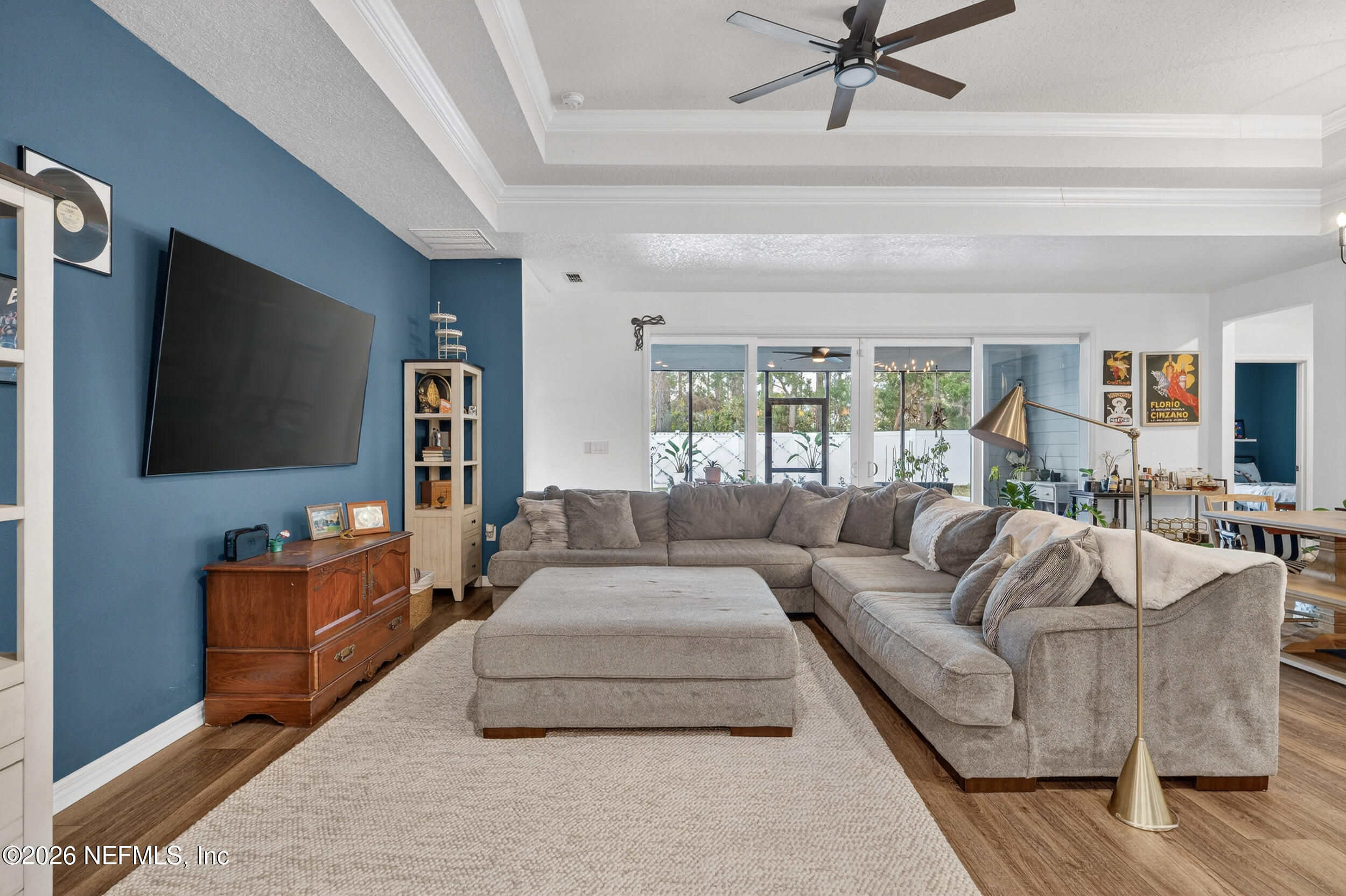 4558 Farmhouse Gate Trail Jacksonville, FL 32226 - Photo 12 of 34 a living room with furniture and a flat screen tv
