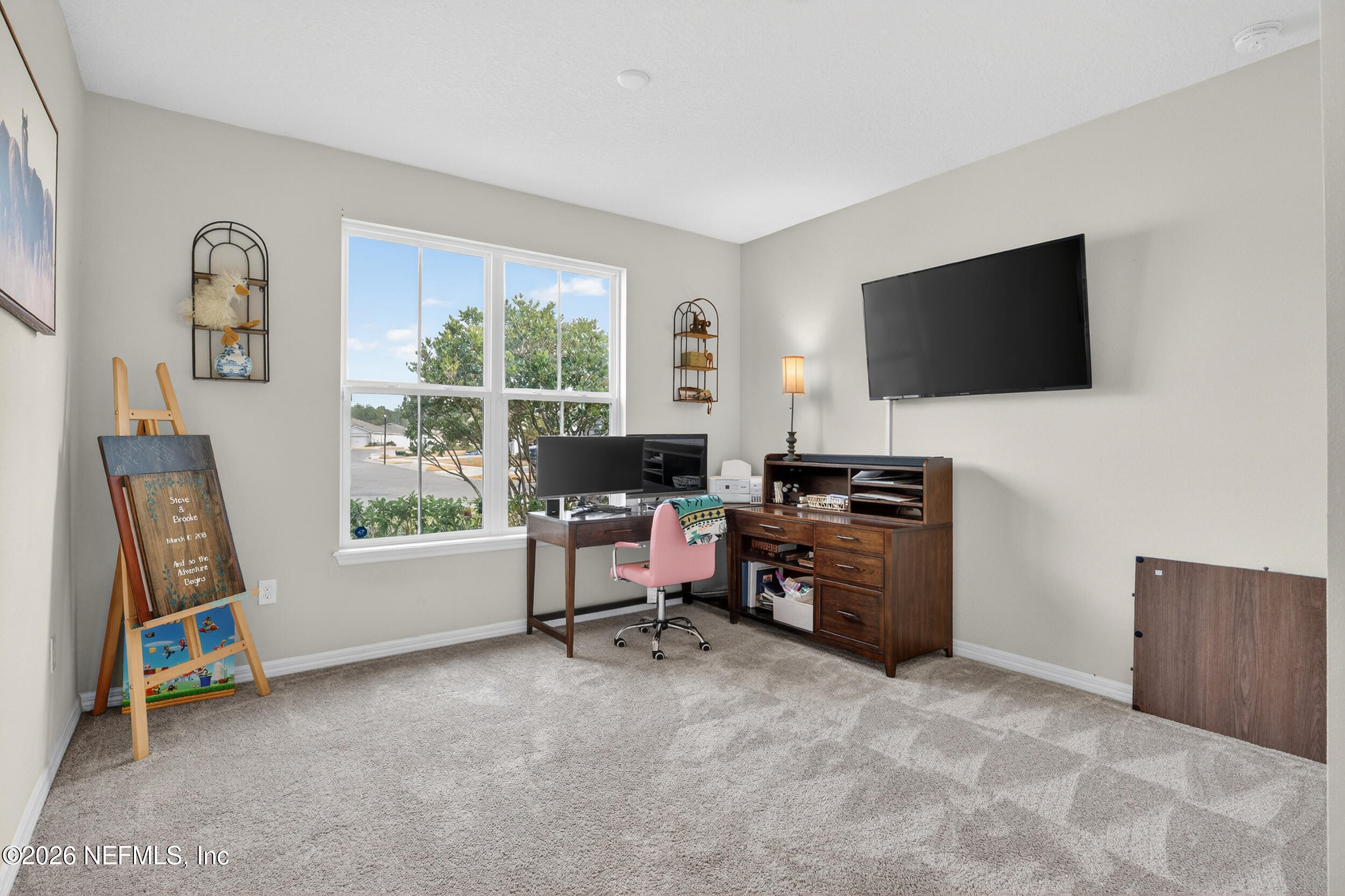 4558 Farmhouse Gate Trail Jacksonville, FL 32226 - Photo 20 of 34 a view of a livingroom with workspace and a window