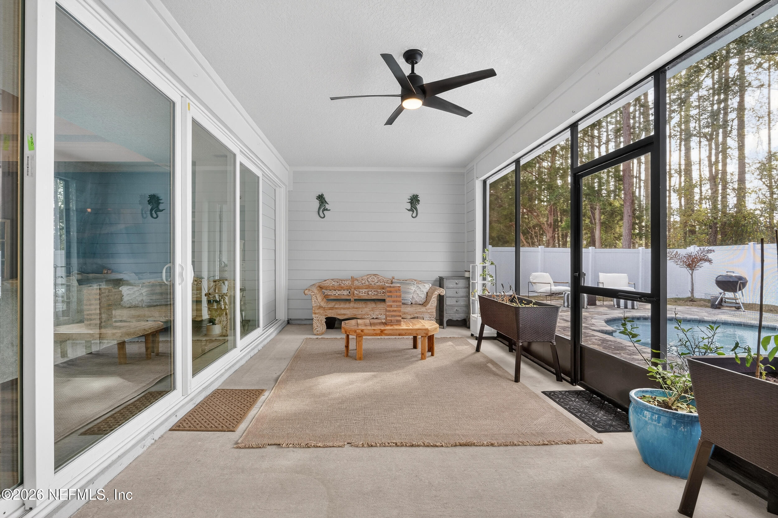 4558 Farmhouse Gate Trail Jacksonville, FL 32226 - Photo 23 of 34 a living room with furniture and a large window