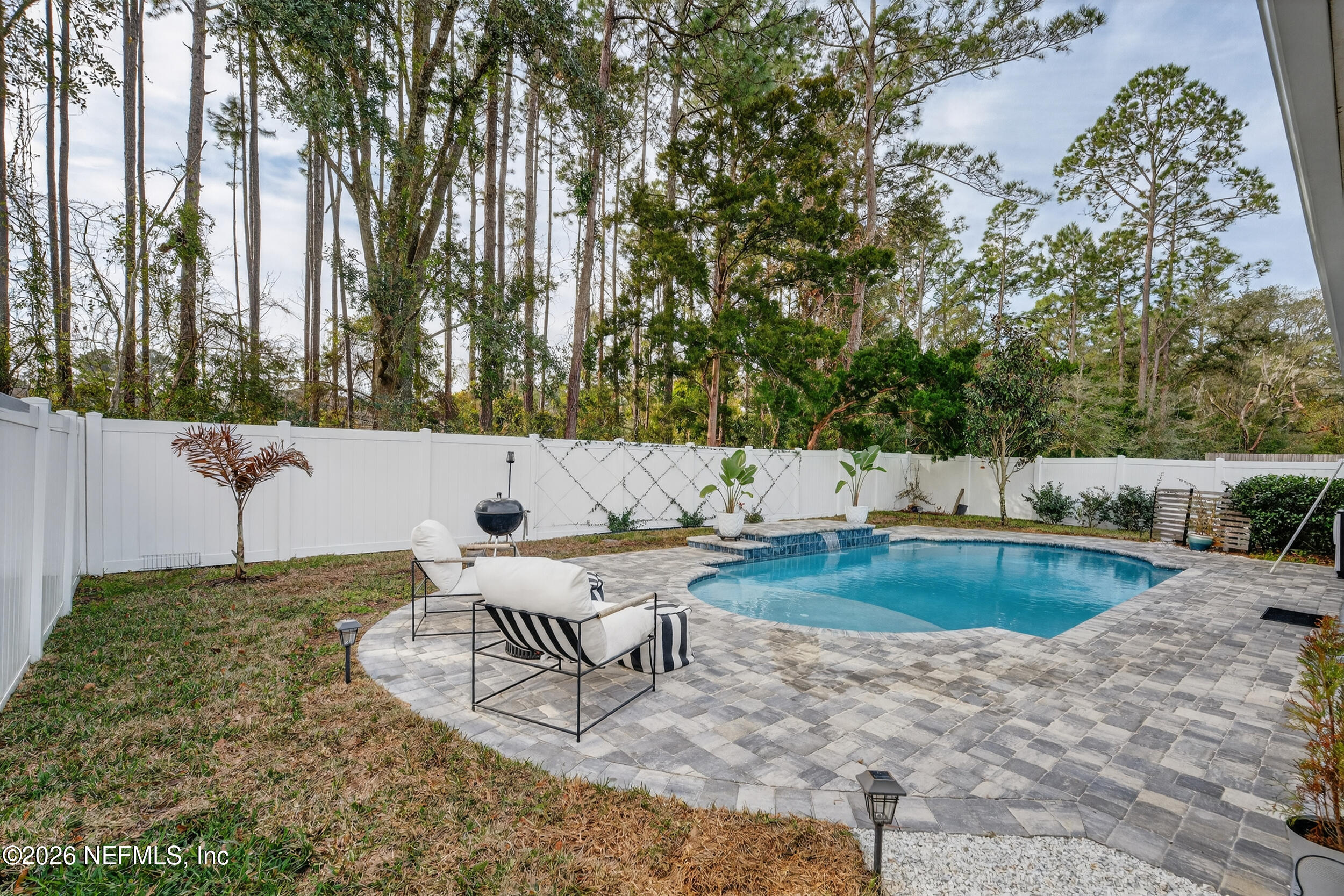 4558 Farmhouse Gate Trail Jacksonville, FL 32226 - Photo 24 of 34 a view of a swimming pool with chairs and fire pit