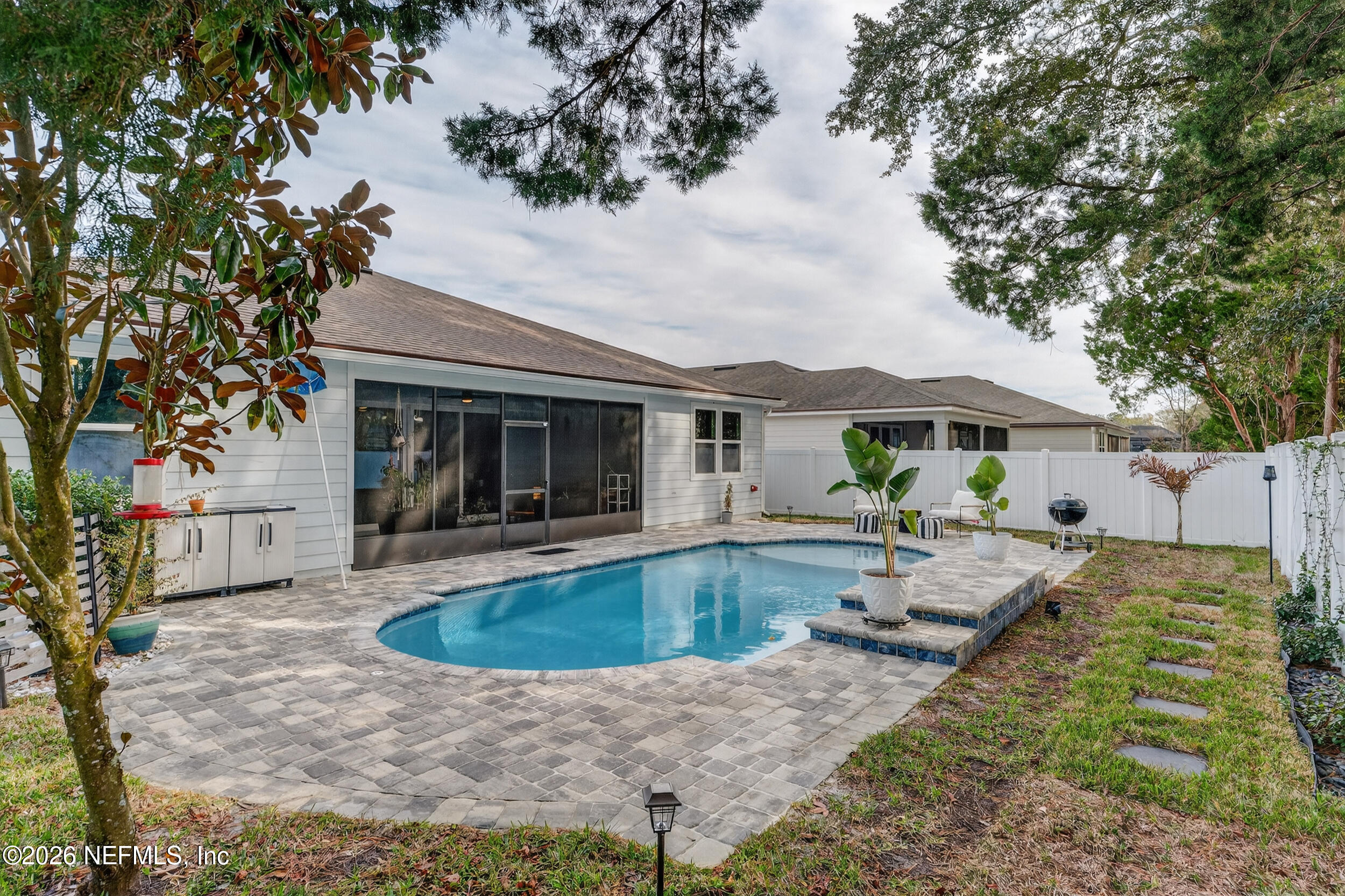 4558 Farmhouse Gate Trail Jacksonville, FL 32226 - Photo 26 of 34 a view of house with swimming pool and furniture