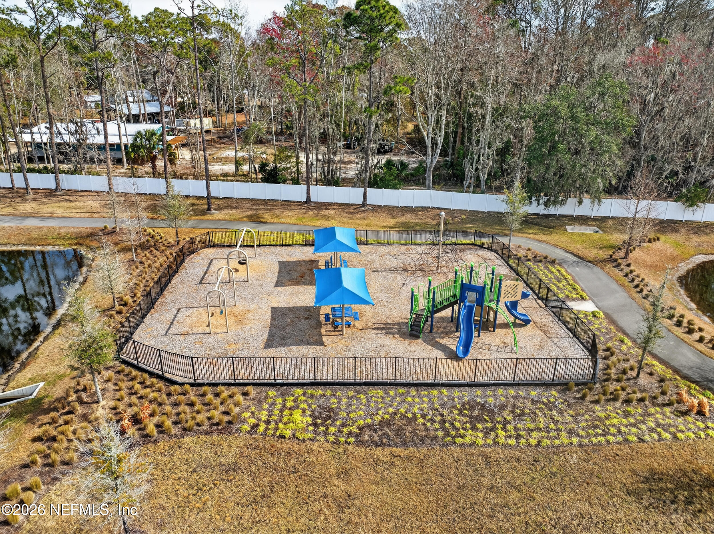 4558 Farmhouse Gate Trail Jacksonville, FL 32226 - Photo 33 of 34 a view of a swimming pool with an outdoor space and seating area