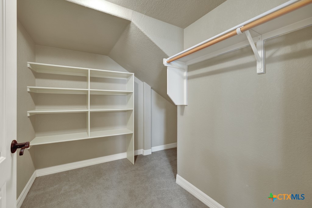 7607 Sky Loop Garden Ridge, TX 78266 - Photo 25 of 43 a view of an empty walk in closet