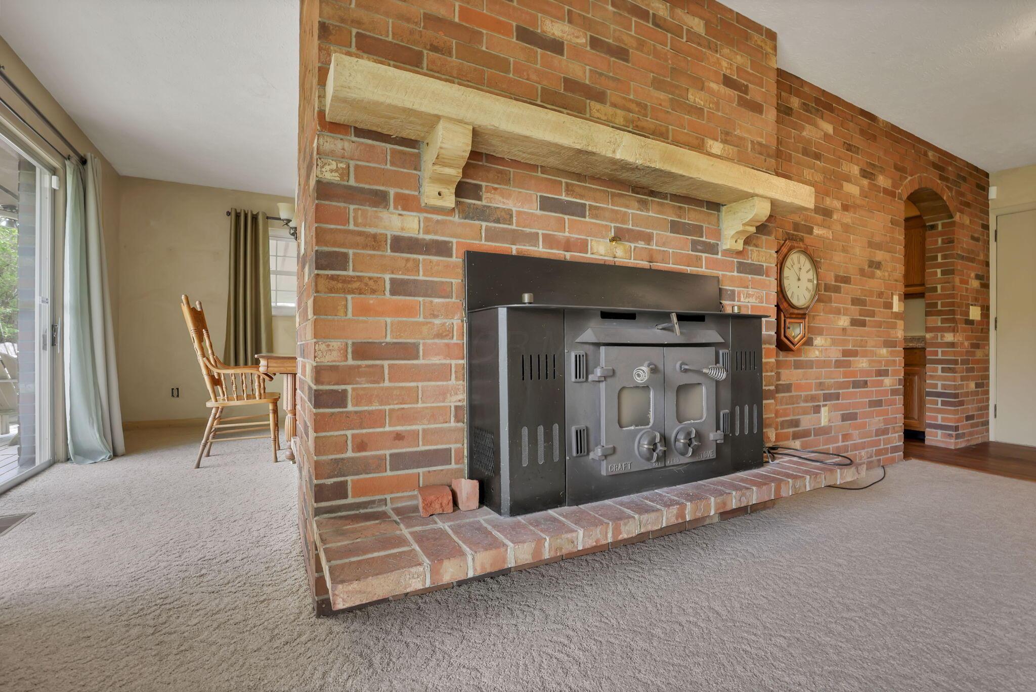 7766 Rodebaugh Road Reynoldsburg, OH 43068 - Photo 11 of 59 Entry family room wood burning insert