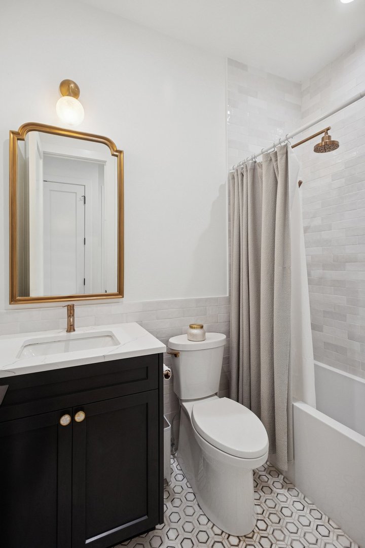 2622 North Racine Avenue, Unit 3 Chicago, IL 60614 - Photo 16 of 28 a bathroom with a sink a toilet and shower
