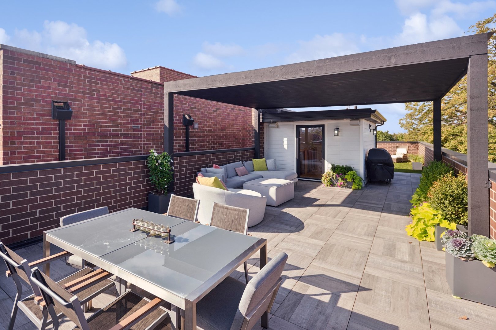 2622 North Racine Avenue, Unit 3 Chicago, IL 60614 - Photo 24 of 28 a view of a patio with table and chairs potted plants with wooden floor