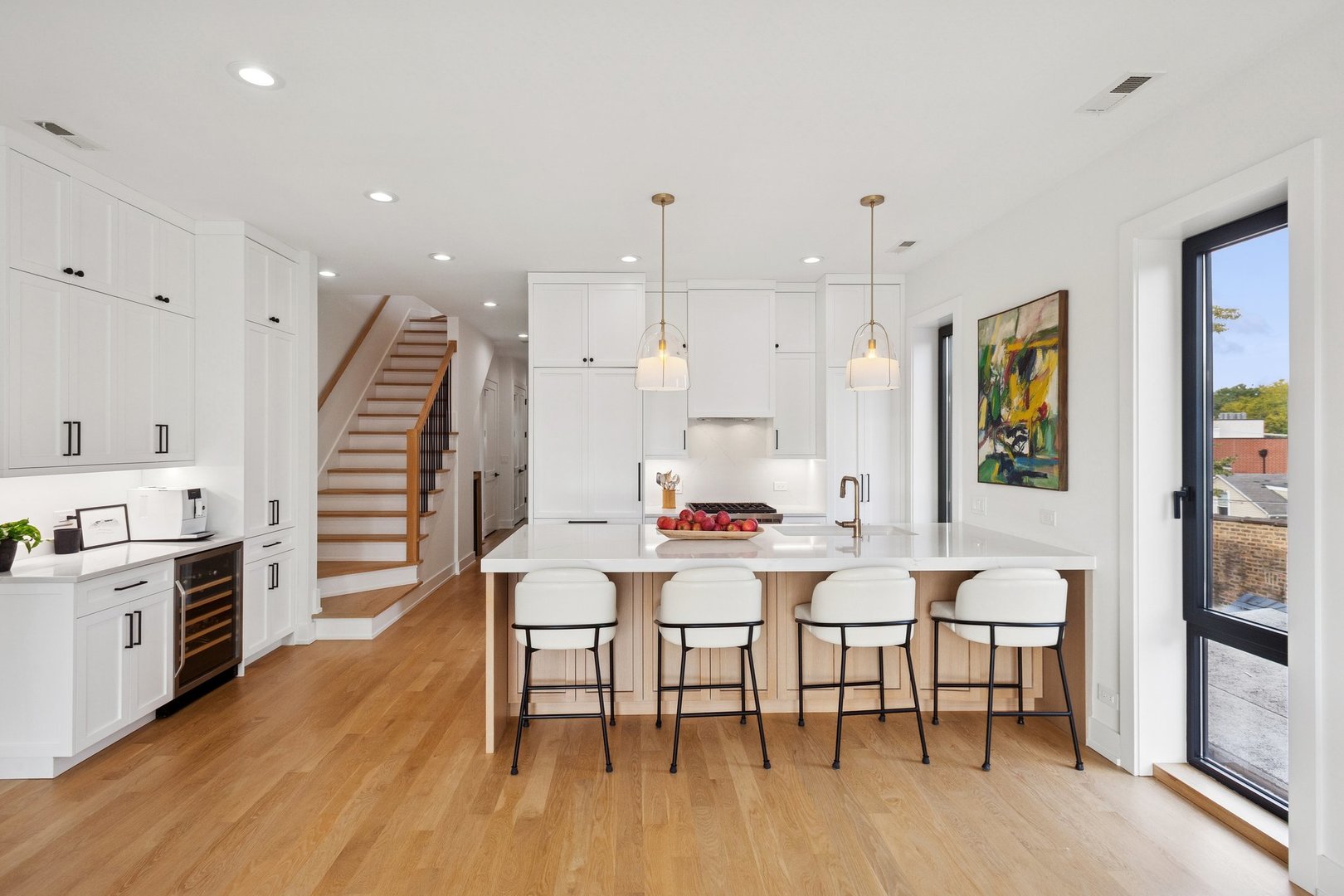 2622 North Racine Avenue, Unit 3 Chicago, IL 60614 - Photo 6 of 28 a room with stainless steel appliances a dining table wooden floor and a view of kitchen