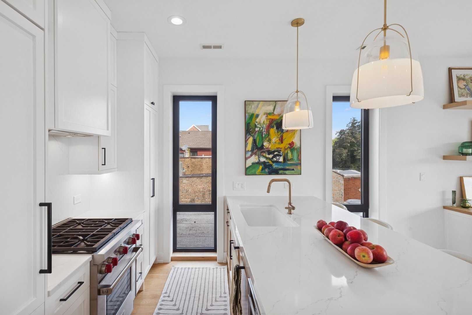 2622 North Racine Avenue, Unit 3 Chicago, IL 60614 - Photo 8 of 28 a kitchen with stainless steel appliances granite countertop a stove a sink and a wooden floor