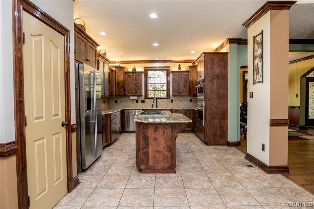 7365 Cedarcrest Road Hanover, VA 23069 - Photo 17 of 50 a large kitchen with stainless steel appliances a refrigerator and a stove