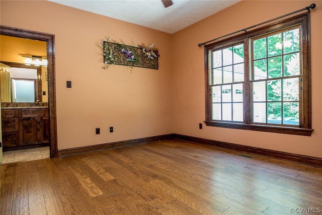 7365 Cedarcrest Road Hanover, VA 23069 - Photo 28 of 50 an empty room with wooden floor and windows