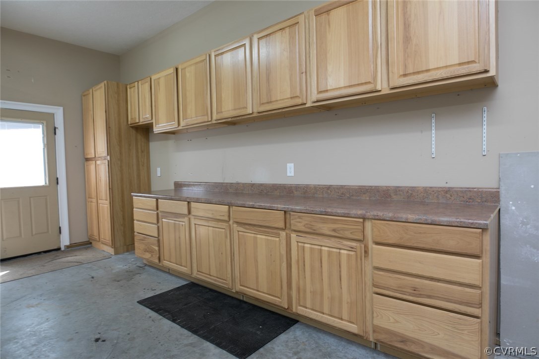 7365 Cedarcrest Road Hanover, VA 23069 - Photo 46 of 50 a kitchen with granite countertop white cabinets and a stainless steel appliances