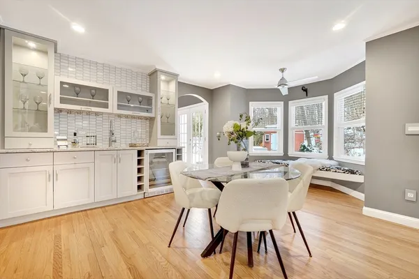 a view of a dining room with furniture and wooden floor