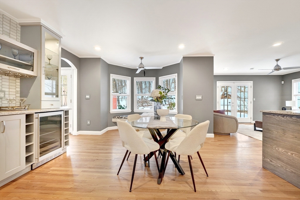 447 Waban Avenue Newton, MA 02462 - Photo 12 of 42 a view of a dining room with furniture and wooden floor