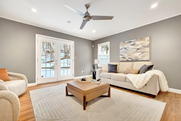 a living room with furniture and a large window