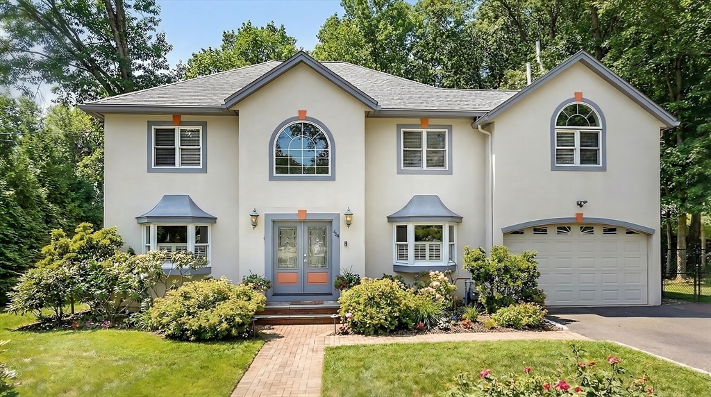 447 Waban Avenue Newton, MA 02462 - Photo 2 of 42 a front view of a house with a garden