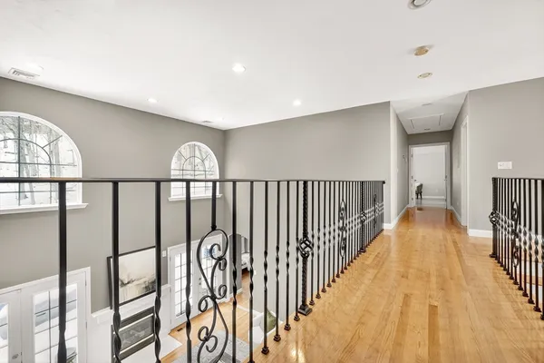 a living room with furniture fireplace and wooden floor