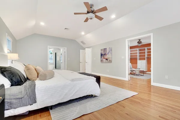 a bedroom with furniture and a window