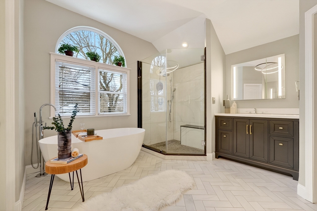 447 Waban Avenue Newton, MA 02462 - Photo 29 of 42 a spacious bathroom with a tub sink and mirror