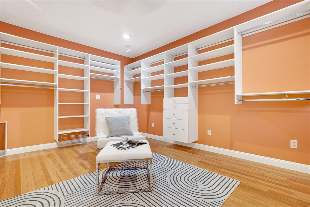 447 Waban Avenue Newton, MA 02462 - Photo 31 of 42 a living room with a couch and a table with wooden floor