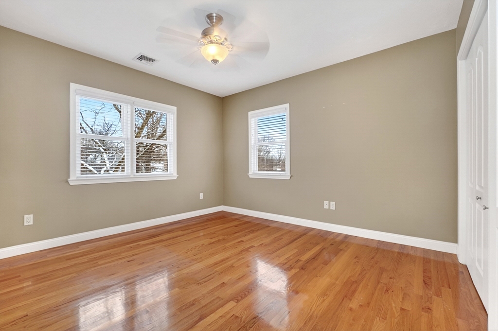 447 Waban Avenue Newton, MA 02462 - Photo 33 of 42 a view of empty room with wooden floor and fan