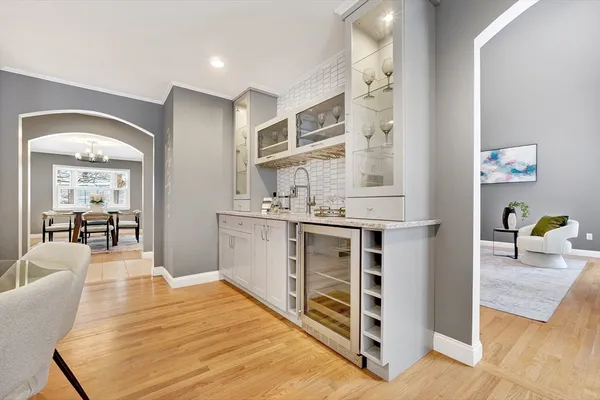 a bedroom with a bed and a view of kitchen