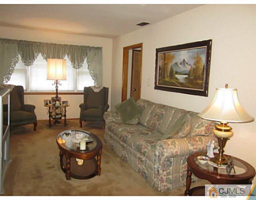50 Gurley Road Edison, NJ 08817 - Photo 5 of 10 a living room with furniture and a table